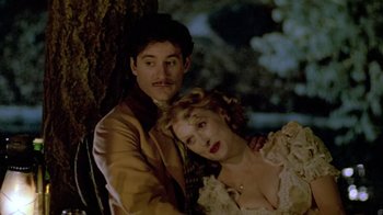 Movie still from “Sophie's Choice” (1982), directed by Alan J. Pakula – A man and a woman sitting next to each other; Close Up shot, Low angle