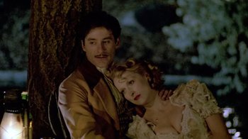 Movie still from “Sophie's Choice” (1982), directed by Alan J. Pakula – A man and a woman sitting next to each other; Medium shot, High angle