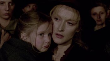 Movie still from “Sophie's Choice” (1982), directed by Alan J. Pakula – A woman and a girl are looking at the camera; Close Up shot, Over the shoulder angle