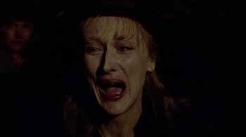 Movie still from “Sophie's Choice” (1982), directed by Alan J. Pakula – A person with her mouth wide open; Close Up shot, High angle