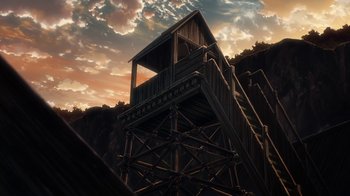 Movie still from “Attack on Titan” (2013), directed by Masashi Koizuka – A wooden structure sitting on top of a hill; Extreme Wide shot, Low angle