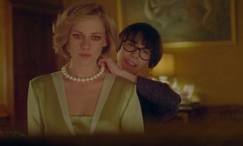 Movie still from “Spencer” (2021), directed by Pablo Larraín – A woman standing next to a woman wearing a necklace; Medium shot, Over the shoulder angle
