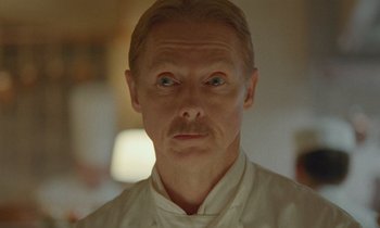 Movie still from “Spencer” (2021), directed by Pablo Larraín – A person wearing a white shirt; Close Up shot, Low angle