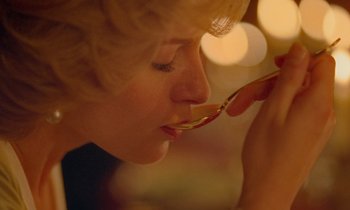 Movie still from “Spencer” (2021), directed by Pablo Larraín – A person holding a spoon up to their face; Extreme Close Up shot, Low angle