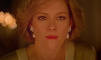 Movie still from “Spencer” (2021), directed by Pablo Larraín – A woman's face in a yellow dress; Close Up shot, Overhead angle