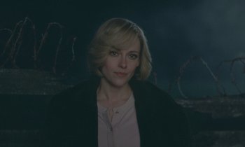 Movie still from “Spencer” (2021), directed by Pablo Larraín – A woman with blonde hair wearing a black jacket; Close Up shot, Over the shoulder angle