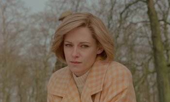 Movie still from “Spencer” (2021), directed by Pablo Larraín – A person wearing a jacket; Close Up shot, High angle