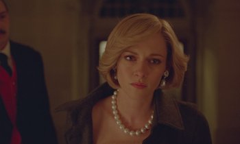Movie still from “Spencer” (2021), directed by Pablo Larraín – A person wearing a pearl necklace; Close Up shot, Over the shoulder angle