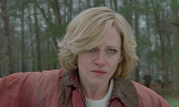 Movie still from “Spencer” (2021), directed by Pablo Larraín – A person wearing a jacket near a forest; Close Up shot, Over the shoulder angle