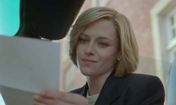 Movie still from “Spencer” (2021), directed by Pablo Larraín – A person sitting in front of a laptop; Close Up shot, Over the shoulder angle