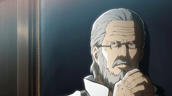 Movie still from “Attack on Titan” (2013), directed by Masashi Koizuka – An old man with a long gray beard is looking at the camera; Close Up shot, Over the shoulder angle