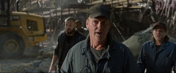 Movie still from “Spider-Man: Homecoming” (2017), directed by Jon Watts – A man with a hat and a beard standing next to another man; Close Up shot, Low angle