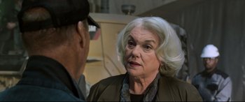 Movie still from “Spider-Man: Homecoming” (2017), directed by Jon Watts – An older woman talking to an older man in front of an oven; Close Up shot, Over the shoulder angle