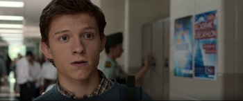 Movie still from “Spider-Man: Homecoming” (2017), directed by Jon Watts – A person in a room near a door; Close Up shot, Over the shoulder angle