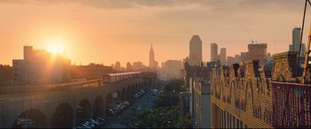 Movie still from “Spider-Man: Homecoming” (2017), directed by Jon Watts – A train is traveling on a bridge over a river; Extreme Wide shot, Low angle