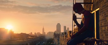 Movie still from “Spider-Man: Homecoming” (2017), directed by Jon Watts – A view of a city skyline at sunset; Wide shot, Low angle