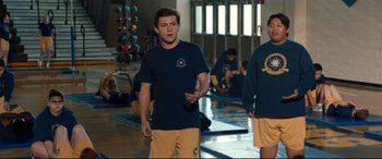 Movie still from “Spider-Man: Homecoming” (2017), directed by Jon Watts – A group of young men standing in a room; Medium shot, Over the shoulder angle