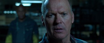 Movie still from “Spider-Man: Homecoming” (2017), directed by Jon Watts – A man's face in a dark room; Close Up shot, Over the shoulder angle