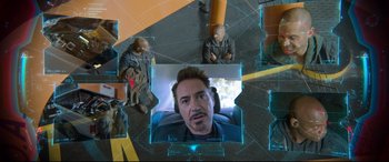 Movie still from “Spider-Man: Homecoming” (2017), directed by Jon Watts – A picture of a man in a car with two other men in the background; Close Up shot, Overhead angle