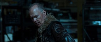 Movie still from “Spider-Man: Homecoming” (2017), directed by Jon Watts – A man wearing a leather jacket with a fur collar; Close Up shot, Over the shoulder angle