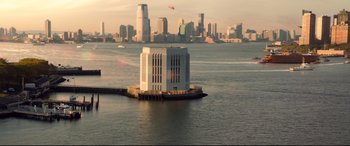 Movie still from “Spider-Man: Homecoming” (2017), directed by Jon Watts – A large building in the middle of a body of water; Extreme Wide shot, High angle