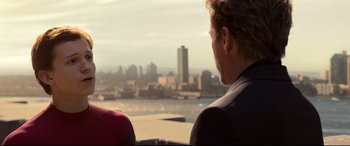 Movie still from “Spider-Man: Homecoming” (2017), directed by Jon Watts – A man and a woman looking out over a city; Close Up shot, Over the shoulder angle