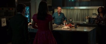 Movie still from “Spider-Man: Homecoming” (2017), directed by Jon Watts – A man and a woman in a kitchen looking at each other; Medium shot, Over the shoulder angle