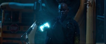 Movie still from “Spider-Man: Homecoming” (2017), directed by Jon Watts – A man holding a glowing object in his hand; Medium shot, Low angle