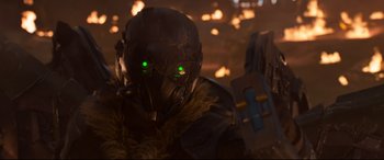 Movie still from “Spider-Man: Homecoming” (2017), directed by Jon Watts – A person wearing a helmet with green eyes; Close Up shot, Low angle