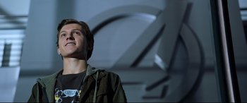 Movie still from “Spider-Man: Homecoming” (2017), directed by Jon Watts – A man standing in front of a wall; Medium shot, Over the shoulder angle