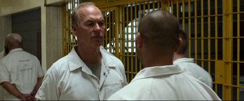 Movie still from “Spider-Man: Homecoming” (2017), directed by Jon Watts – A man in a white shirt is looking at another man; Close Up shot, Over the shoulder angle