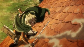 Movie still from “Attack on Titan” (2013), directed by Masashi Koizuka – A man in a green cape is holding two swords; Wide shot, Low angle