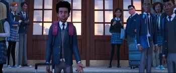 Movie still from “Spider-Man: Into the Spider-Verse” (2018), directed by Peter Ramsey – A man and a woman standing in front of a building; Medium shot, Over the shoulder angle