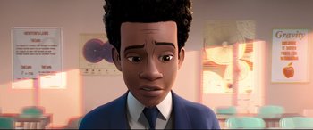 Movie still from “Spider-Man: Into the Spider-Verse” (2018), directed by Peter Ramsey – A man in a suit and tie is looking at the camera; Close Up shot, High angle