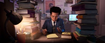 Movie still from “Spider-Man: Into the Spider-Verse” (2018), directed by Peter Ramsey – A man sitting at a table with a book and a pen; Medium shot, High angle