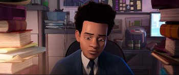 Movie still from “Spider-Man: Into the Spider-Verse” (2018), directed by Peter Ramsey – An animated man in a suit and tie in an office setting; Close Up shot, High angle