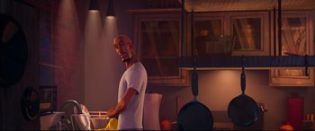 Movie still from “Spider-Man: Into the Spider-Verse” (2018), directed by Peter Ramsey – An animated man is cooking in the kitchen; Medium shot, Over the shoulder angle
