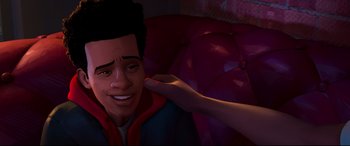 Movie still from “Spider-Man: Into the Spider-Verse” (2018), directed by Peter Ramsey – A person touching a man's face in a cartoon; Close Up shot, Over the shoulder angle