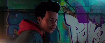 Movie still from “Spider-Man: Into the Spider-Verse” (2018), directed by Peter Ramsey – A young man with a red shirt is looking at the camera; Close Up shot, Over the shoulder angle