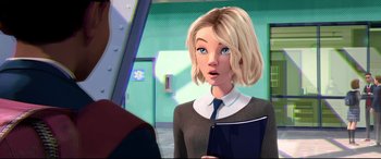 Movie still from “Spider-Man: Into the Spider-Verse” (2018), directed by Peter Ramsey – An animated woman with blonde hair holding a book; Close Up shot, Over the shoulder angle
