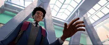Movie still from “Spider-Man: Into the Spider-Verse” (2018), directed by Peter Ramsey – An animated man in a suit and a tie; Medium shot, Low angle