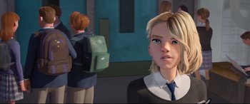 Movie still from “Spider-Man: Into the Spider-Verse” (2018), directed by Peter Ramsey – A girl with blonde hair and a blue tie is standing in front of another girl with blonde hair and a green backpack; Close Up shot, Over the shoulder angle