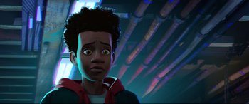 Movie still from “Spider-Man: Into the Spider-Verse” (2018), directed by Peter Ramsey – A young man with a surprised look on his face; Close Up shot, Low angle
