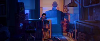 Movie still from “Spider-Man: Into the Spider-Verse” (2018), directed by Peter Ramsey – A man sitting at a table in a room; Extreme Wide shot, Over the shoulder angle