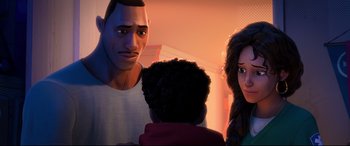 Movie still from “Spider-Man: Into the Spider-Verse” (2018), directed by Peter Ramsey – A man and a woman standing next to a young boy; Close Up shot, Over the shoulder angle