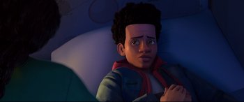 Movie still from “Spider-Man: Into the Spider-Verse” (2018), directed by Peter Ramsey – An animated boy is looking at the camera; Close Up shot, High angle