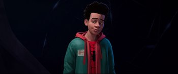 Movie still from “Spider-Man: Into the Spider-Verse” (2018), directed by Peter Ramsey – A young man wearing a green and red jacket; Medium shot, Over the shoulder angle
