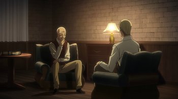 Movie still from “Attack on Titan” (2013), directed by Masashi Koizuka – Two people sitting in chairs in a room; Wide shot, High angle