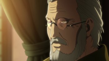 Movie still from “Attack on Titan” (2013), directed by Masashi Koizuka – An old man with a gray beard wearing glasses; Close Up shot, Over the shoulder angle