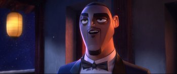 Movie still from “Spies in Disguise” (2019), directed by Troy Quane – A person wearing a suit and bow tie; Close Up shot, Low angle